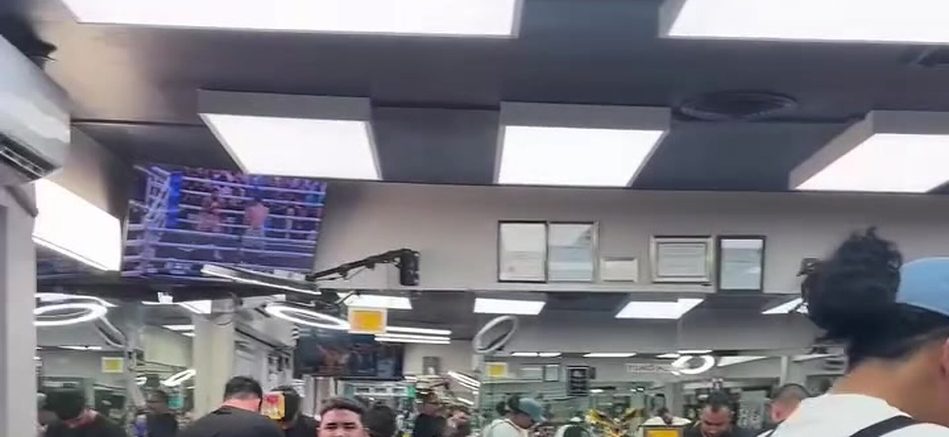 Inside Boulevard Barber Shop, barbers working the floor